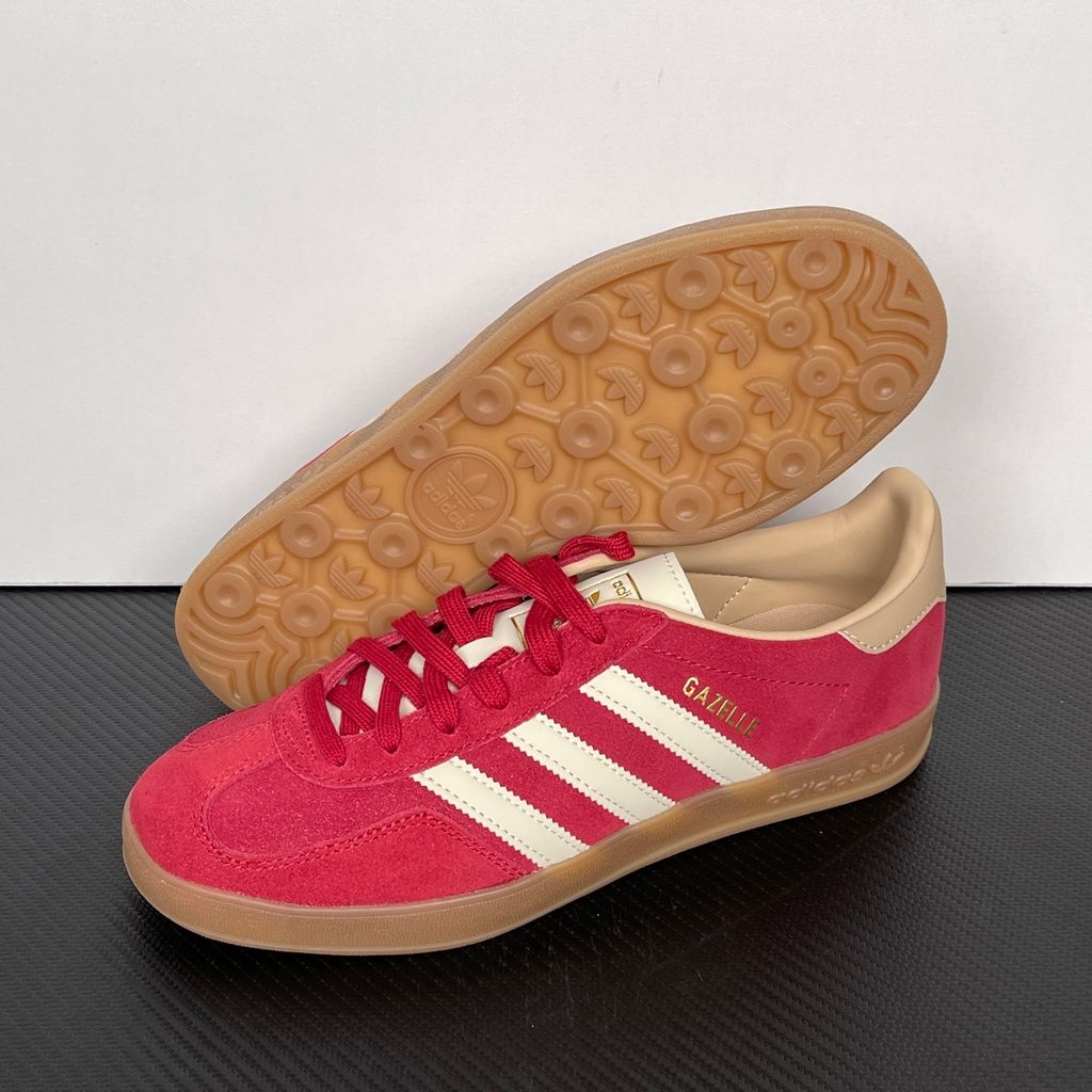 Shop adidas Gazelle Indoor KI2251 in Team Victory Red, Warm Vanilla and Magic Beige with leather upper, classic 3-Stripes, gold Gazelle branding and rubber outsole.