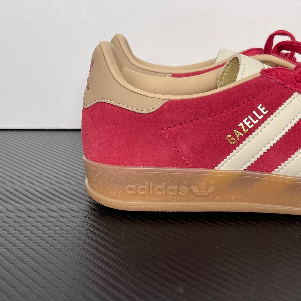 Shop adidas Gazelle Indoor KI2251 in Team Victory Red, Warm Vanilla and Magic Beige with leather upper, classic 3-Stripes, gold Gazelle branding and rubber outsole.