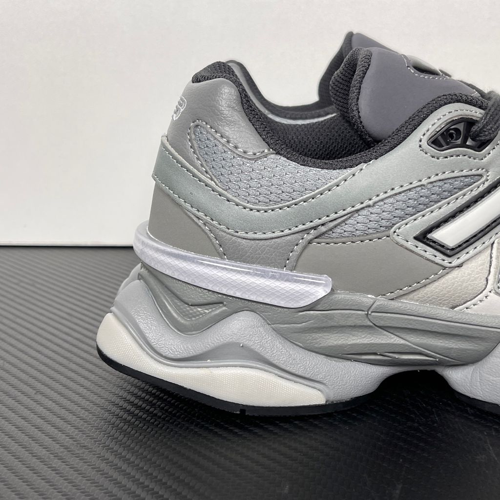 Shop New Balance 9060 U90609XS in Slate Grey and Harbor Grey with mesh and suede upper, ABZORB and SBS cushioning, CR heel device and sculpted Y2K styling.