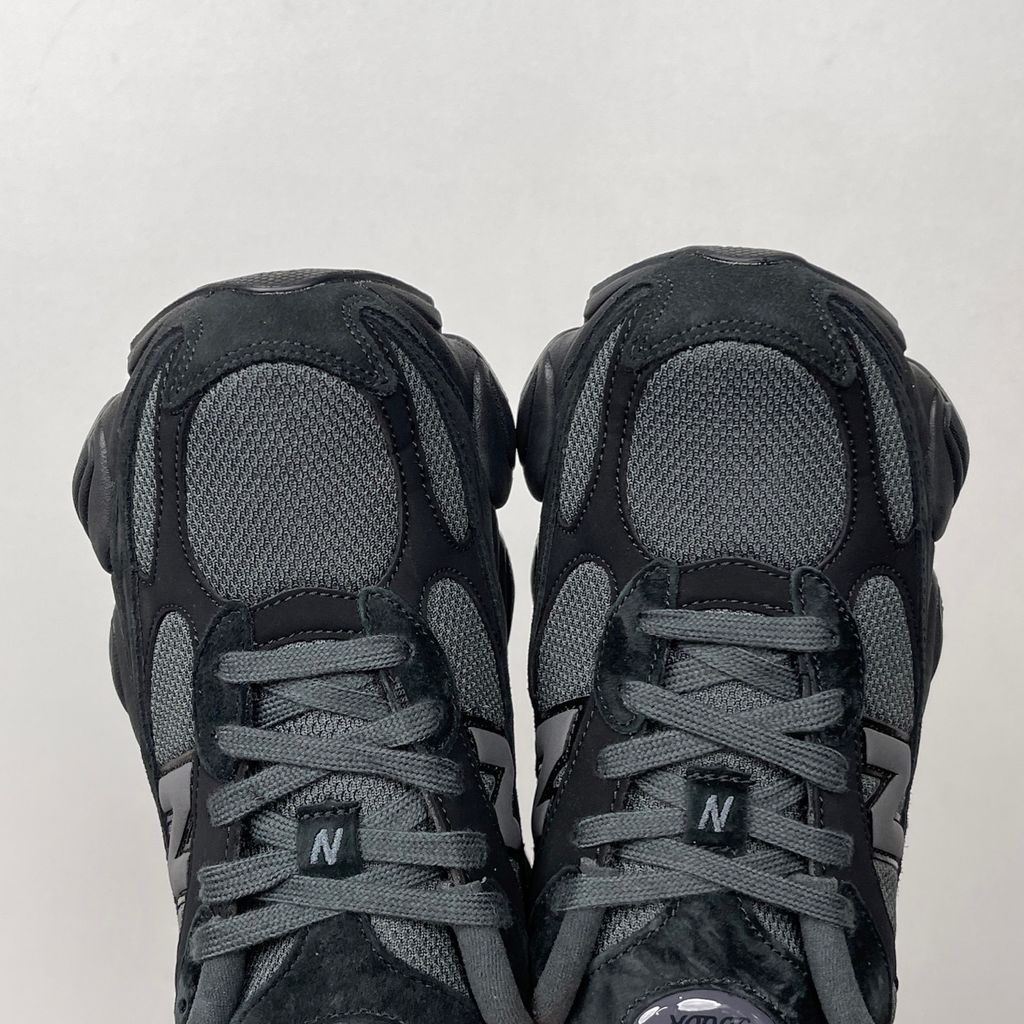 Shop New Balance 9060R U90604U4 in Black and Blacktop with suede and open mesh upper, ABZORB cushioning, split vamp overlays and extended mudguard.