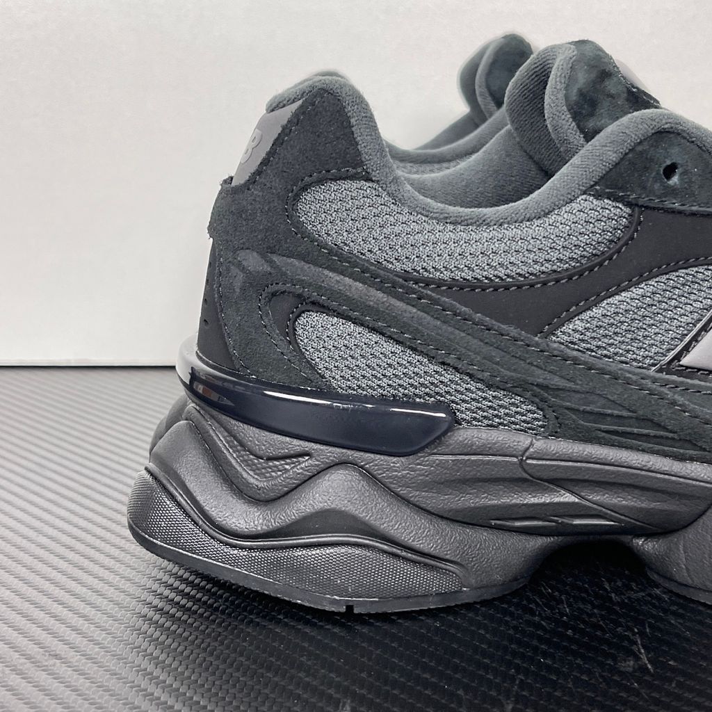 Shop New Balance 9060R U90604U4 in Black and Blacktop with suede and open mesh upper, ABZORB cushioning, split vamp overlays and extended mudguard.