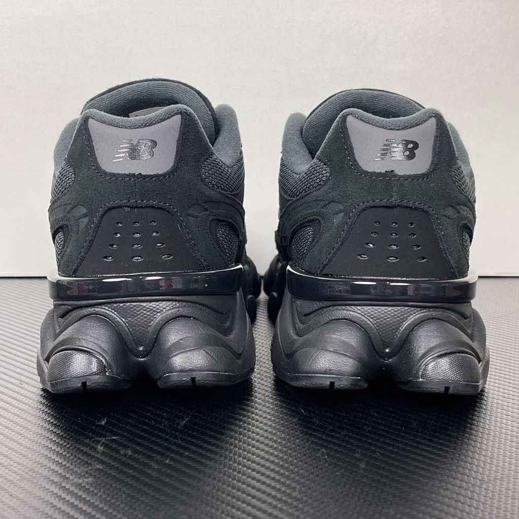 Shop New Balance 9060R U90604U4 in Black and Blacktop with suede and open mesh upper, ABZORB cushioning, split vamp overlays and extended mudguard.