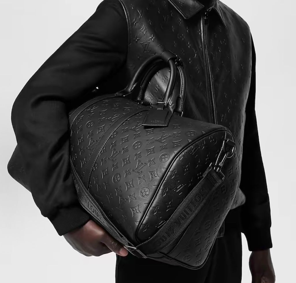 Louis Vuitton Keepall Bandoulière 50 M44810 Black Monogram Shadow leather travel bag Louis Vuitton M44810 Keepall 50 Black embossed Monogram leather weekender bag Louis Vuitton Keepall Bandoulière 50 Black M44810 matte hardware shoulder travel bag