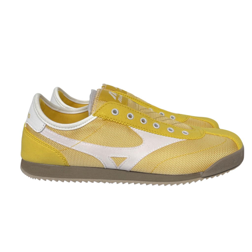 Shop Mizuno LG 60S Slip-On D1GH240216 in Yellow, Star White and Chocolate Brown with lace-free construction and retro low-profile Sportstyle design.