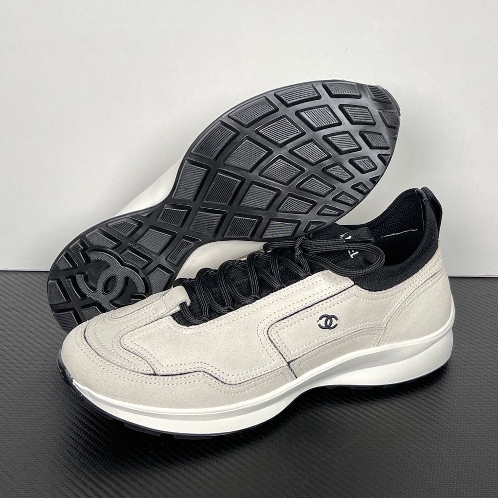 Shop CHANEL 26A Sneakers G47416 B25250 UC402 in White calfskin and suede calfskin with black Double-C detail and retro runner-inspired sole.
