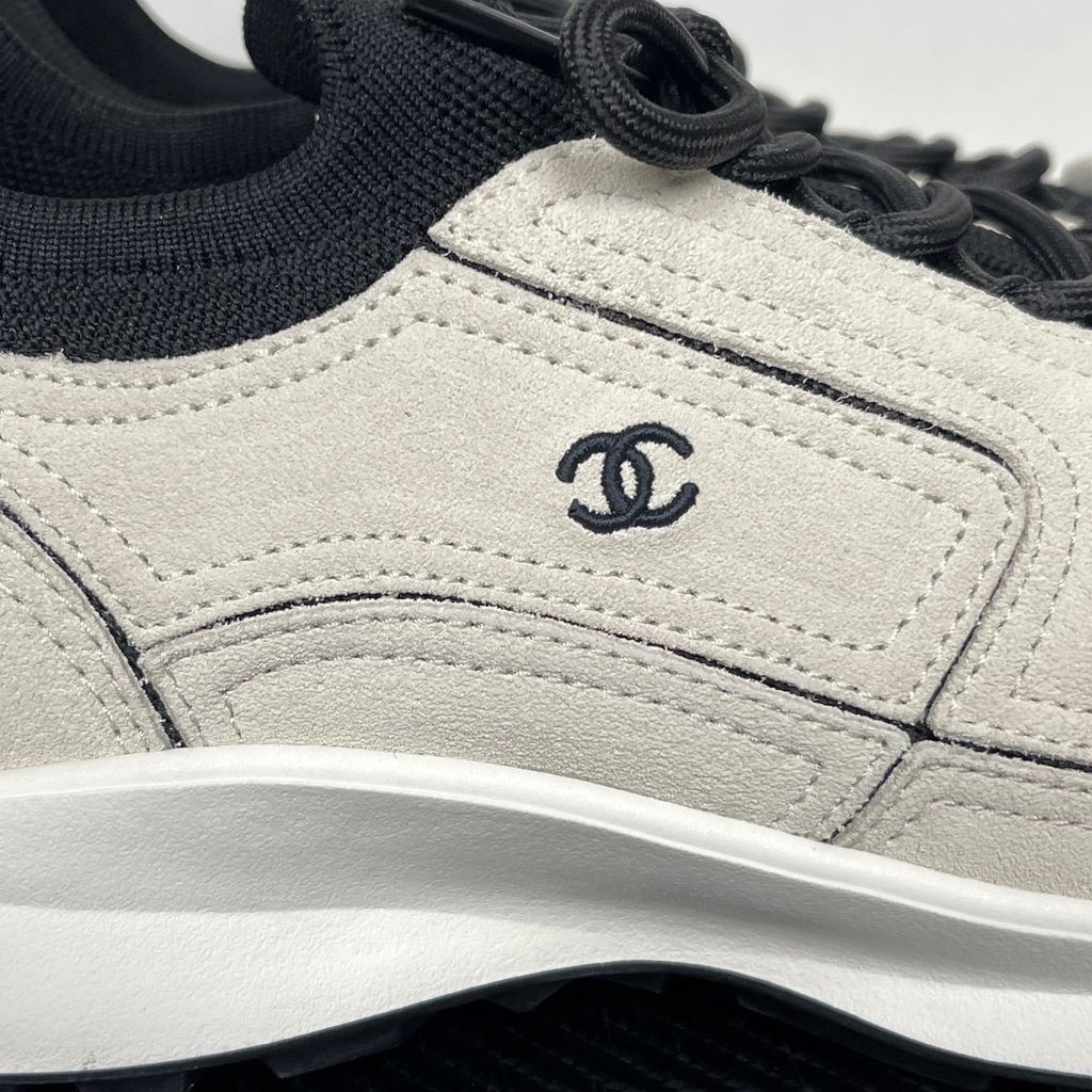 Shop CHANEL 26A Sneakers G47416 B25250 UC402 in White calfskin and suede calfskin with black Double-C detail and retro runner-inspired sole.