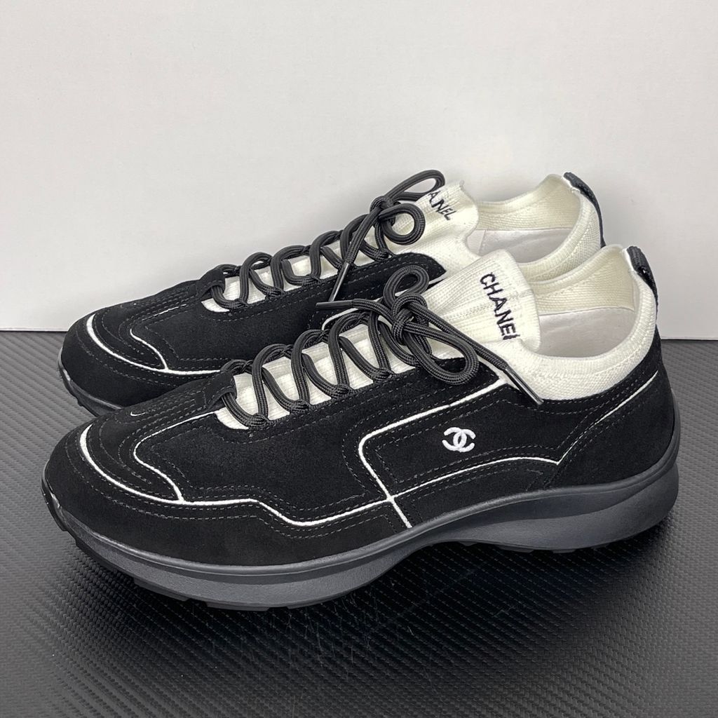 Shop Chanel 26A Sneakers G47416 B25250 UB774 in Black calfskin and suede calfskin with contrast piping, CC logo and substantial lifestyle sole.