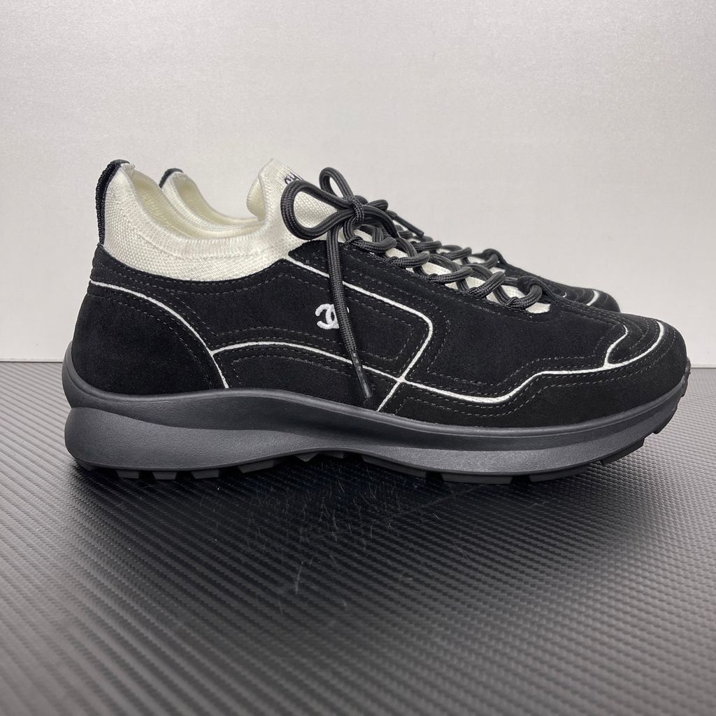 Shop Chanel 26A Sneakers G47416 B25250 UB774 in Black calfskin and suede calfskin with contrast piping, CC logo and substantial lifestyle sole.