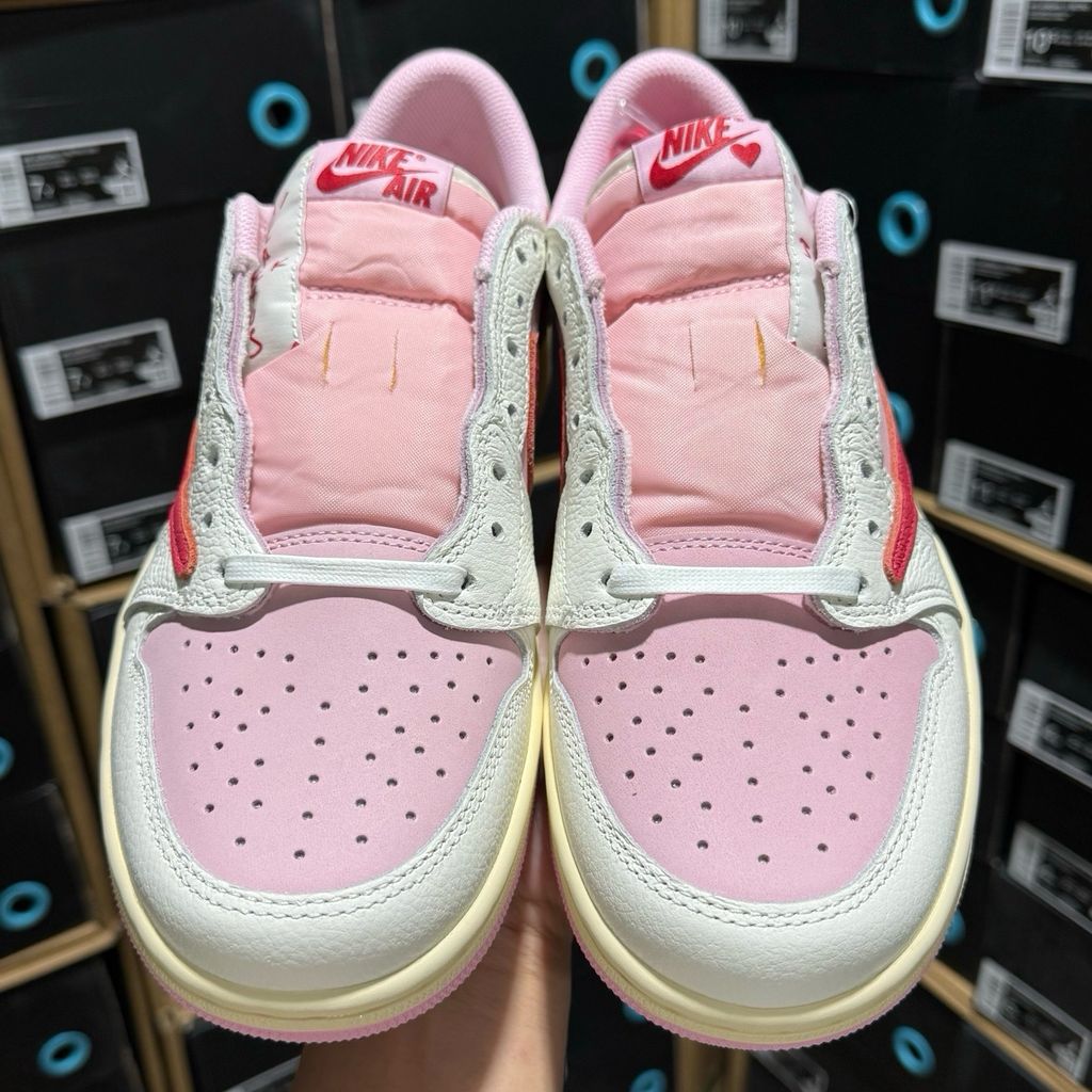 Shop Travis Scott x Air Jordan 1 Low OG SP IQ7604-101 Tropical Pink with premium leather, pink nubuck underlays, reverse Swoosh and co-branded details.