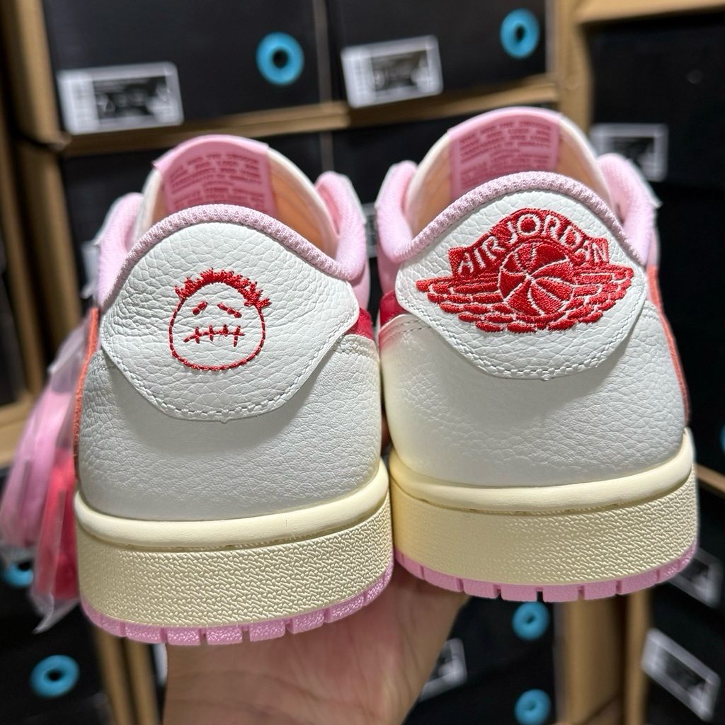 Shop Travis Scott x Air Jordan 1 Low OG SP IQ7604-101 Tropical Pink with premium leather, pink nubuck underlays, reverse Swoosh and co-branded details.