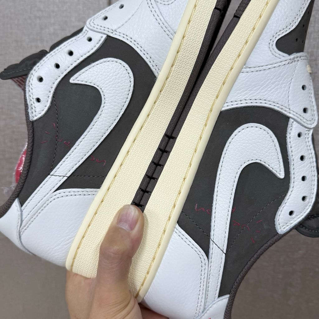 Shop Travis Scott x Air Jordan 1 Low OG Reverse Mocha DM7866-162 in Sail, Ridgerock and University Red with suede, leather, reverse Swoosh and Nike Air cushioning.