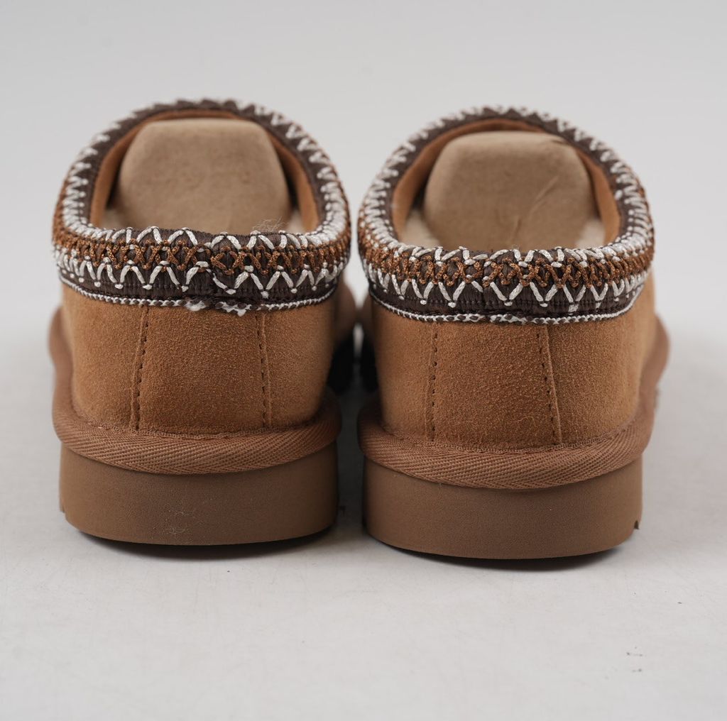 Shop UGG Women's Tasman II 1174470-CHE in Chestnut with suede upper, signature UGGbraid, 17mm sheepskin lining and Sugarcane EVA outsole.