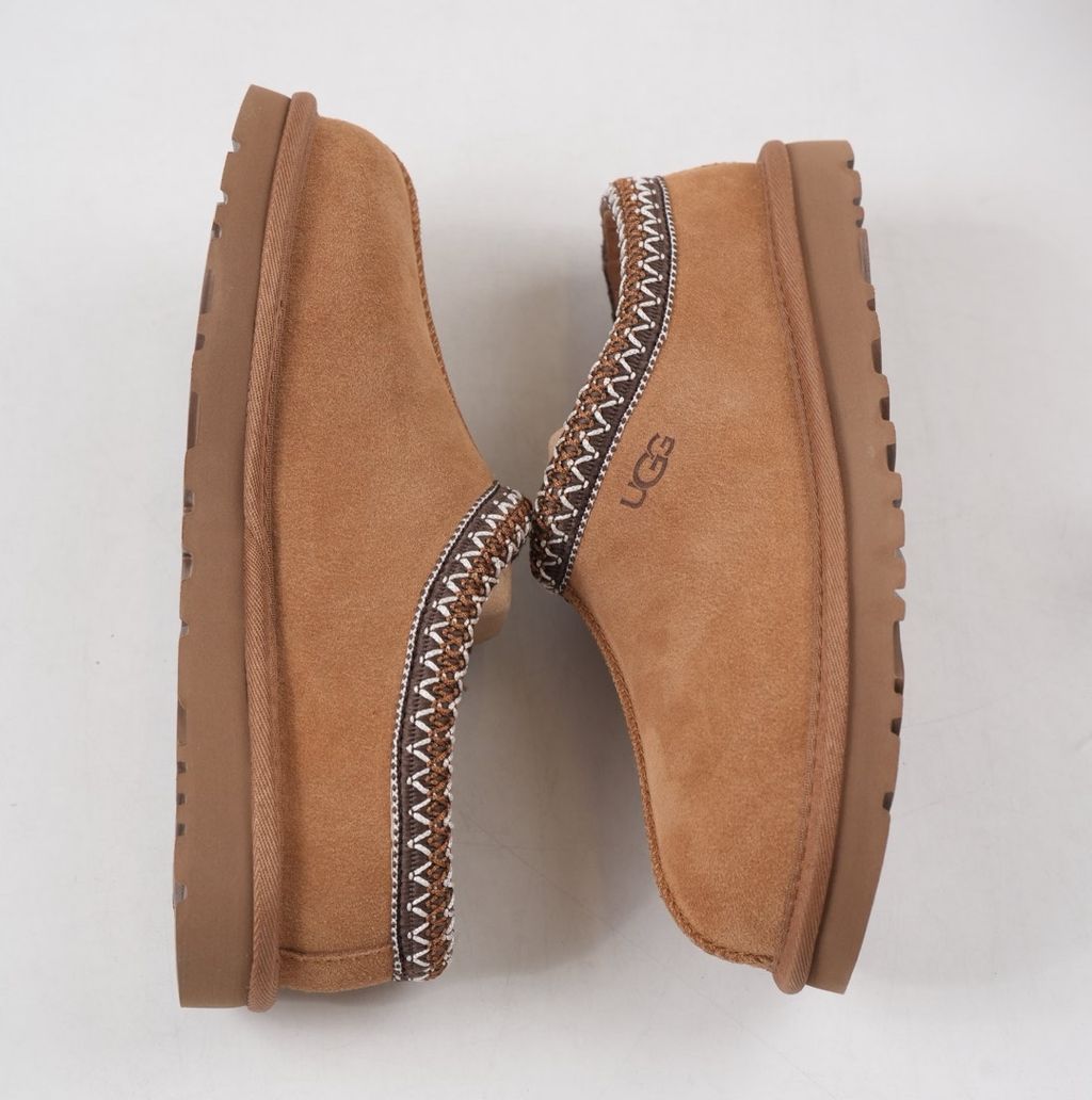 Shop UGG Women's Tasman II 1174470-CHE in Chestnut with suede upper, signature UGGbraid, 17mm sheepskin lining and Sugarcane EVA outsole.
