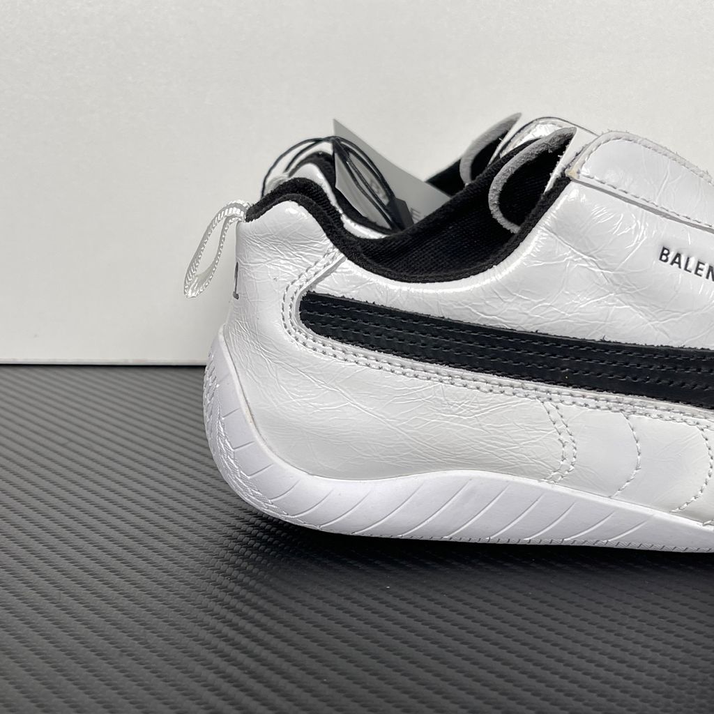 Balenciaga x PUMA Speedcat Leather 847148-WSDSB-9010 White Black Men's Slip-On Sneakers with White Cowskin Leather Upper, Black PUMA Formstrip, Debossed Balenciaga and PUMA Logos, Embroidered PUMA Cat Toe, Reflective Rear Pull Tab and Rubber Outsole