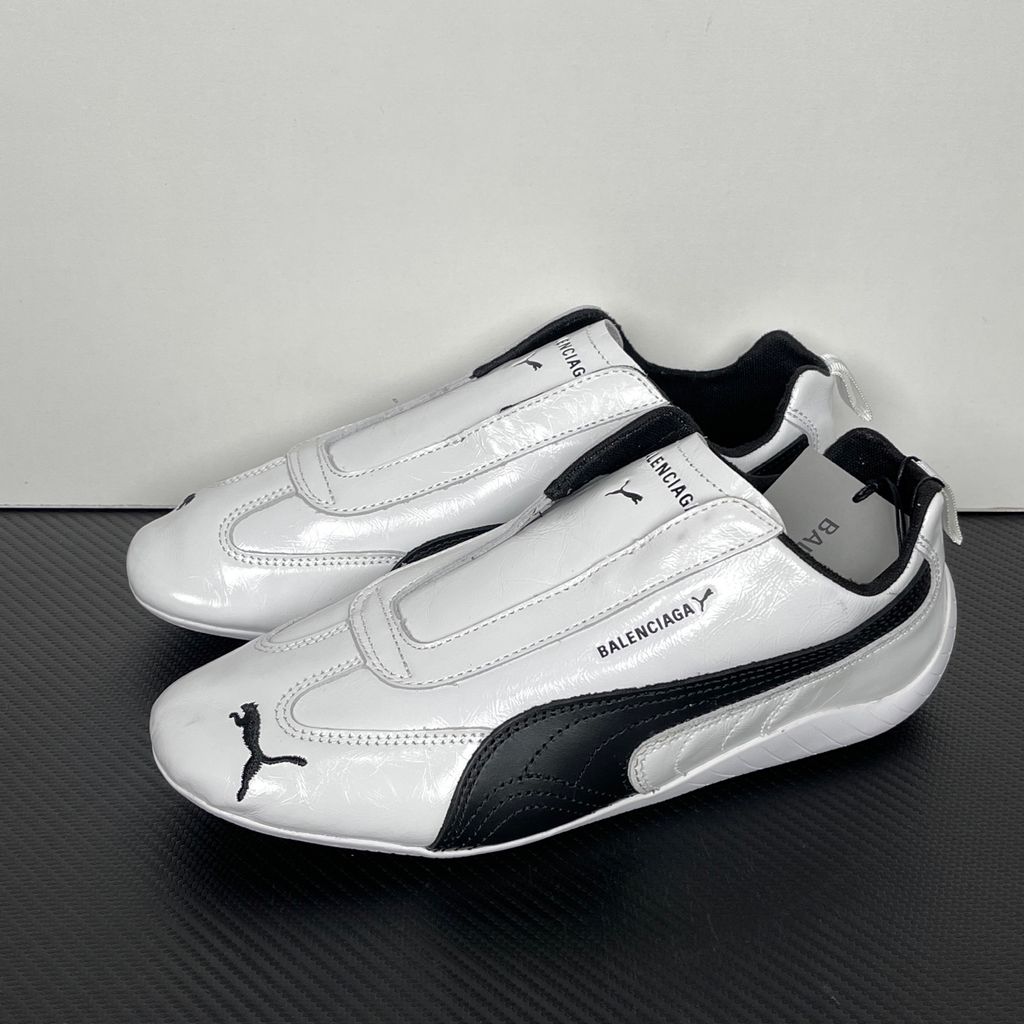 Balenciaga x PUMA Speedcat Leather 847148-WSDSB-9010 White Black Men's Slip-On Sneakers with White Cowskin Leather Upper, Black PUMA Formstrip, Debossed Balenciaga and PUMA Logos, Embroidered PUMA Cat Toe, Reflective Rear Pull Tab and Rubber Outsole