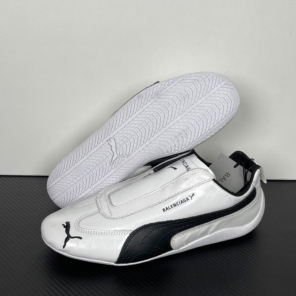 Balenciaga x PUMA Speedcat Leather 847148-WSDSB-9010 White Black Men's Slip-On Sneakers with White Cowskin Leather Upper, Black PUMA Formstrip, Debossed Balenciaga and PUMA Logos, Embroidered PUMA Cat Toe, Reflective Rear Pull Tab and Rubber Outsole