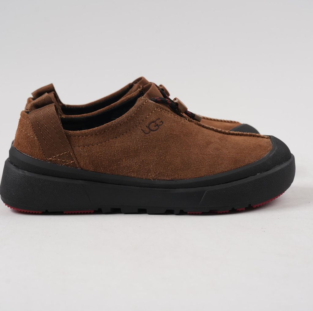 Verified against UGG's current 1179050-DKC Dark Chestnut Tasman Outpost product information, including waterproof suede, seam-sealed construction, 17mm UGGpure/UGGplush interior, Sugarcane EVA and White Spider Rubber outsole. UGG