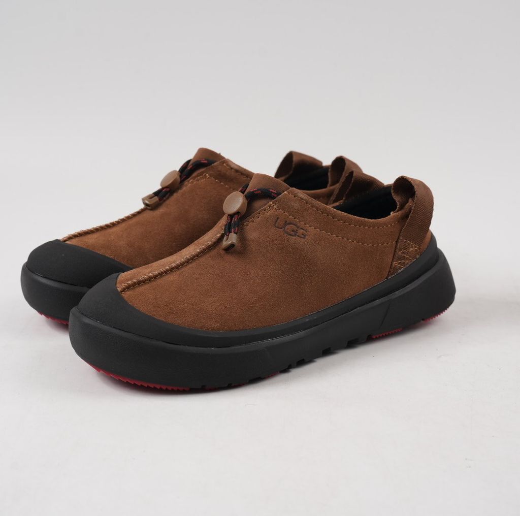 Verified against UGG's current 1179050-DKC Dark Chestnut Tasman Outpost product information, including waterproof suede, seam-sealed construction, 17mm UGGpure/UGGplush interior, Sugarcane EVA and White Spider Rubber outsole. UGG