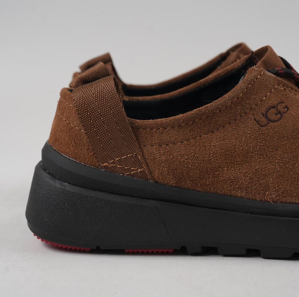 Verified against UGG's current 1179050-DKC Dark Chestnut Tasman Outpost product information, including waterproof suede, seam-sealed construction, 17mm UGGpure/UGGplush interior, Sugarcane EVA and White Spider Rubber outsole. UGG