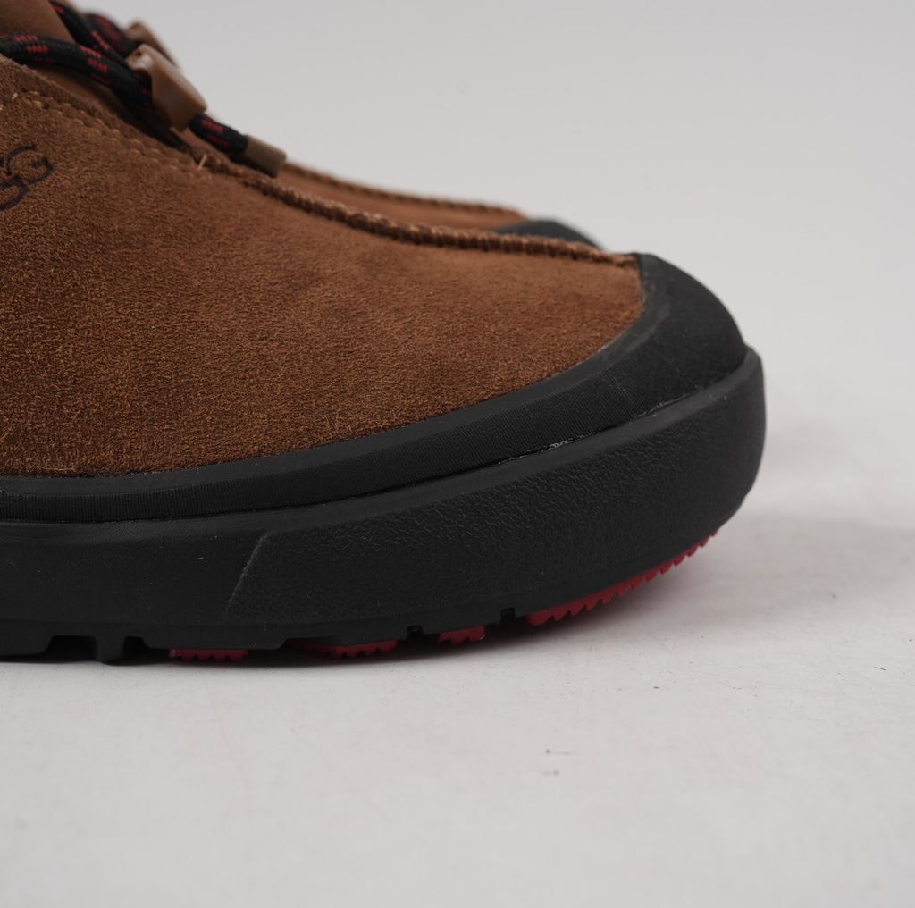 Verified against UGG's current 1179050-DKC Dark Chestnut Tasman Outpost product information, including waterproof suede, seam-sealed construction, 17mm UGGpure/UGGplush interior, Sugarcane EVA and White Spider Rubber outsole. UGG