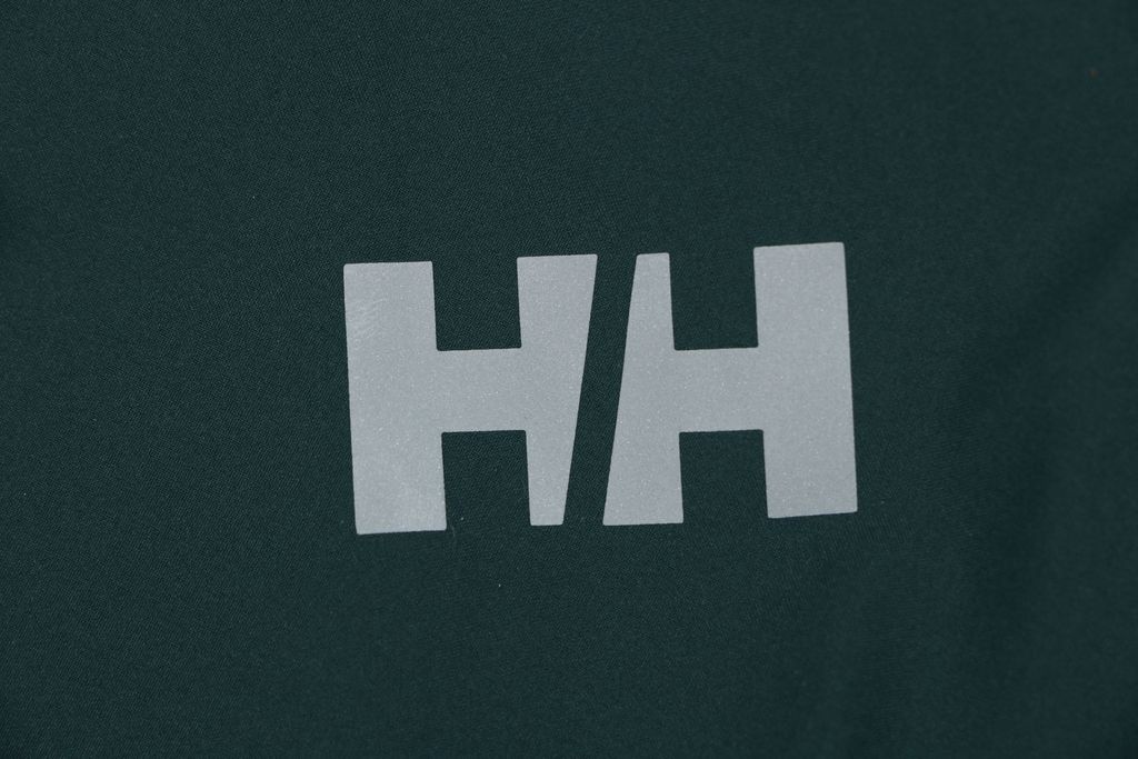Helly Hansen ODIN side zip hooded softshell jacket green four way stretch grid fleece articulated sleeves adjustable helmet compatible hood sizes S-3XL