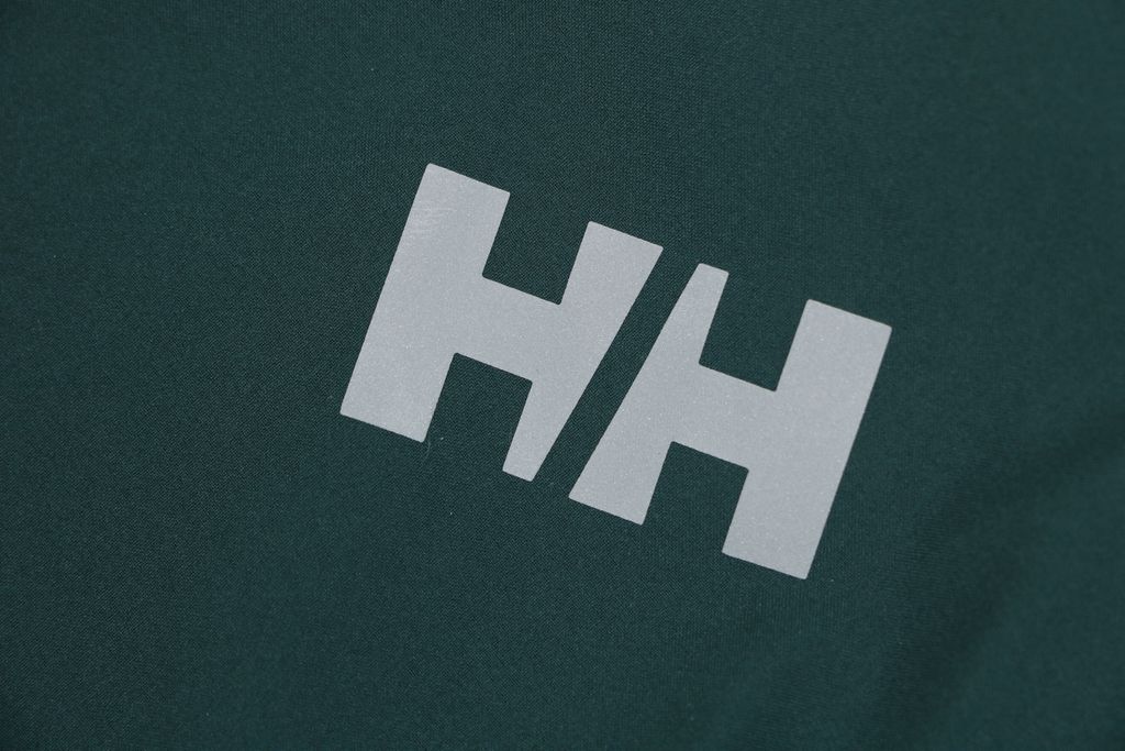 Helly Hansen ODIN side zip hooded softshell jacket green four way stretch grid fleece articulated sleeves adjustable helmet compatible hood sizes S-3XL