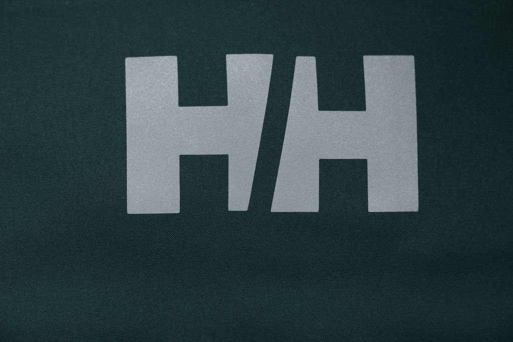 Helly Hansen ODIN side zip hooded softshell jacket green four way stretch grid fleece articulated sleeves adjustable helmet compatible hood sizes S-3XL