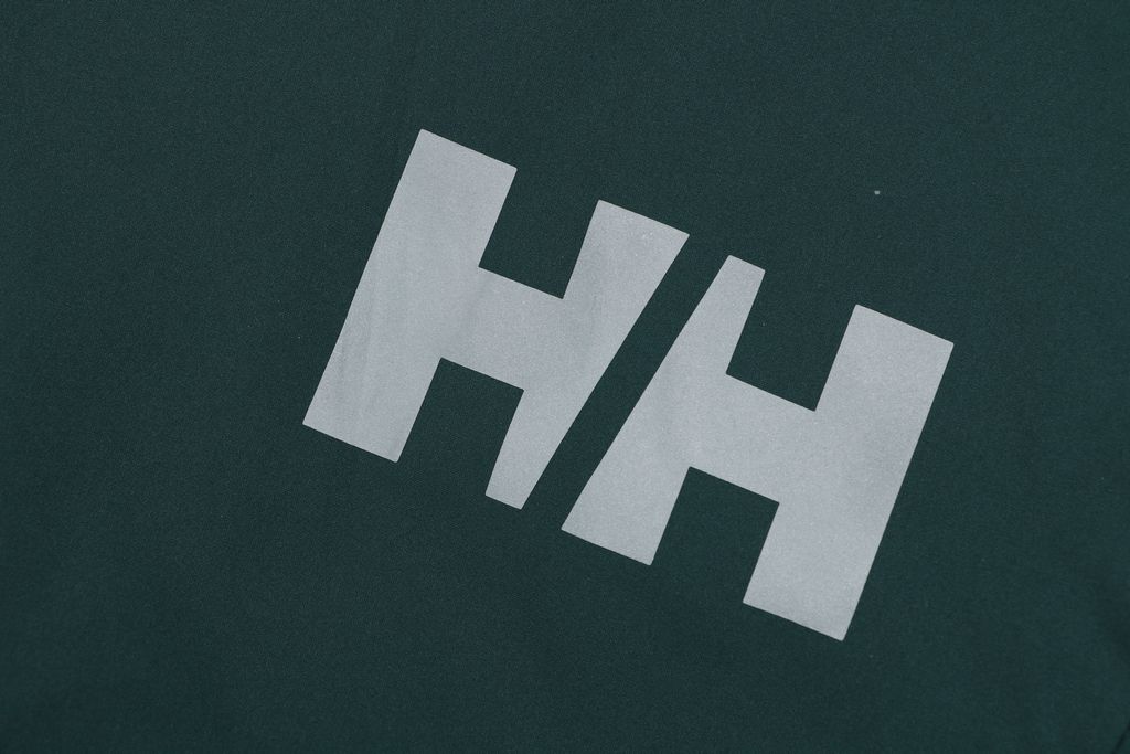 Helly Hansen ODIN side zip hooded softshell jacket green four way stretch grid fleece articulated sleeves adjustable helmet compatible hood sizes S-3XL