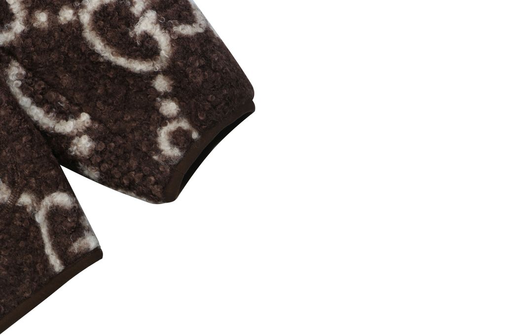 Gucci Double G monogram sherpa fleece jacket brown all over diamond GG jacquard plush high neck zip hidden pockets relaxed unisex outerwear sizes 48 50 52 54 56