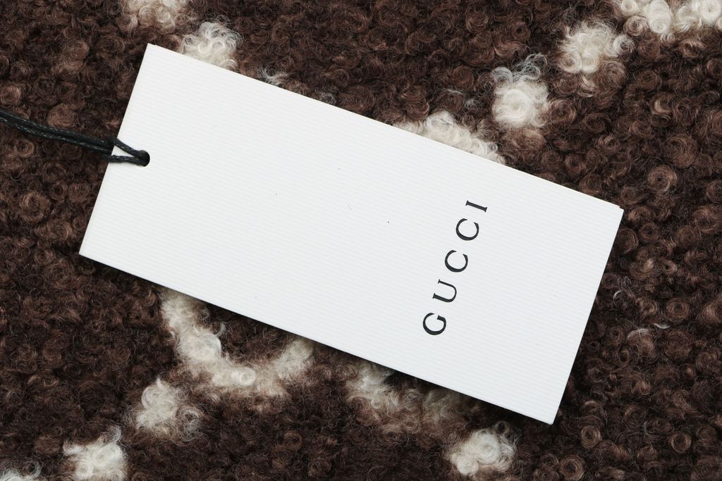 Gucci Double G monogram sherpa fleece jacket brown all over diamond GG jacquard plush high neck zip hidden pockets relaxed unisex outerwear sizes 48 50 52 54 56