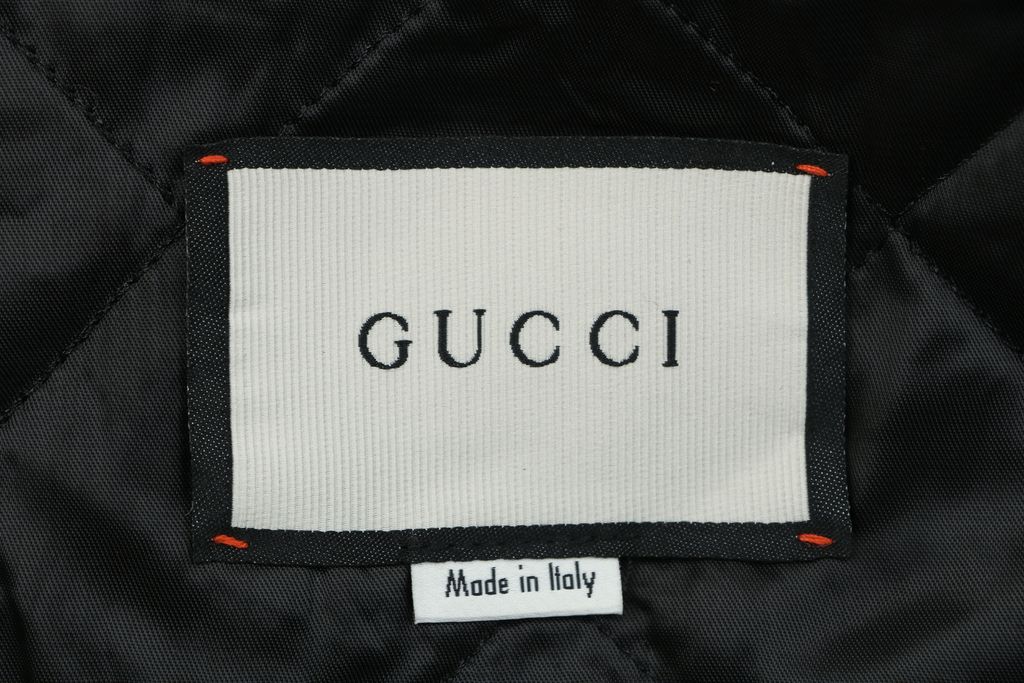 Gucci Double G monogram sherpa fleece jacket brown all over diamond GG jacquard plush high neck zip hidden pockets relaxed unisex outerwear sizes 48 50 52 54 56