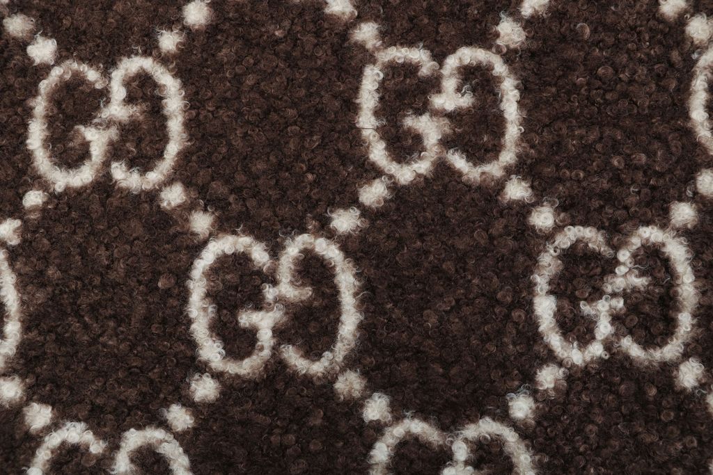 Gucci Double G monogram sherpa fleece jacket brown all over diamond GG jacquard plush high neck zip hidden pockets relaxed unisex outerwear sizes 48 50 52 54 56