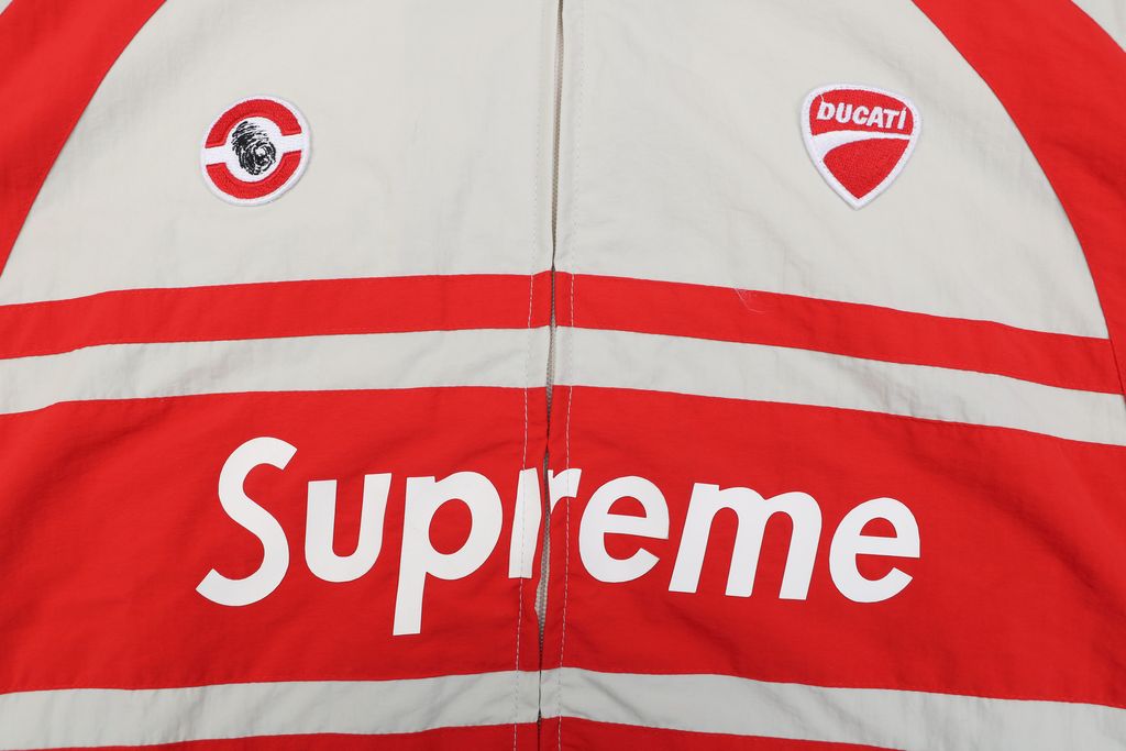 Supreme Ducati racing stand collar track jacket matte technical fabric breathable mesh lining 3D silicone logo metal plaque YKK zipper unisex sizes S-XL