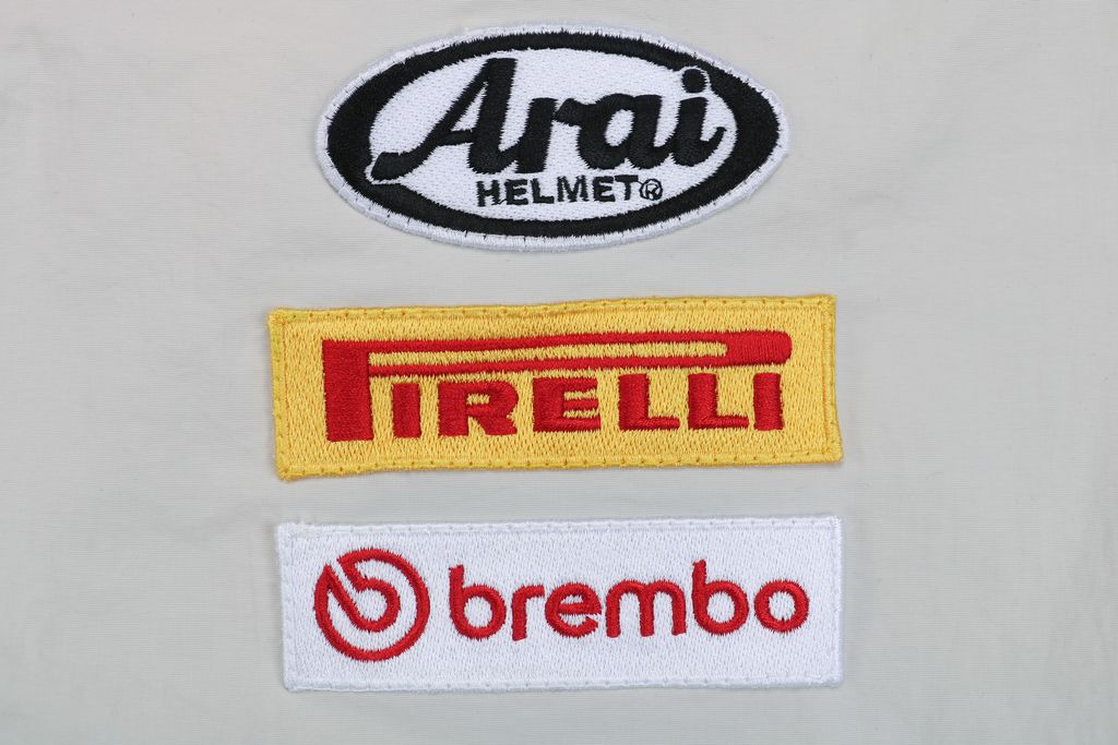 Supreme Ducati racing stand collar track jacket matte technical fabric breathable mesh lining 3D silicone logo metal plaque YKK zipper unisex sizes S-XL