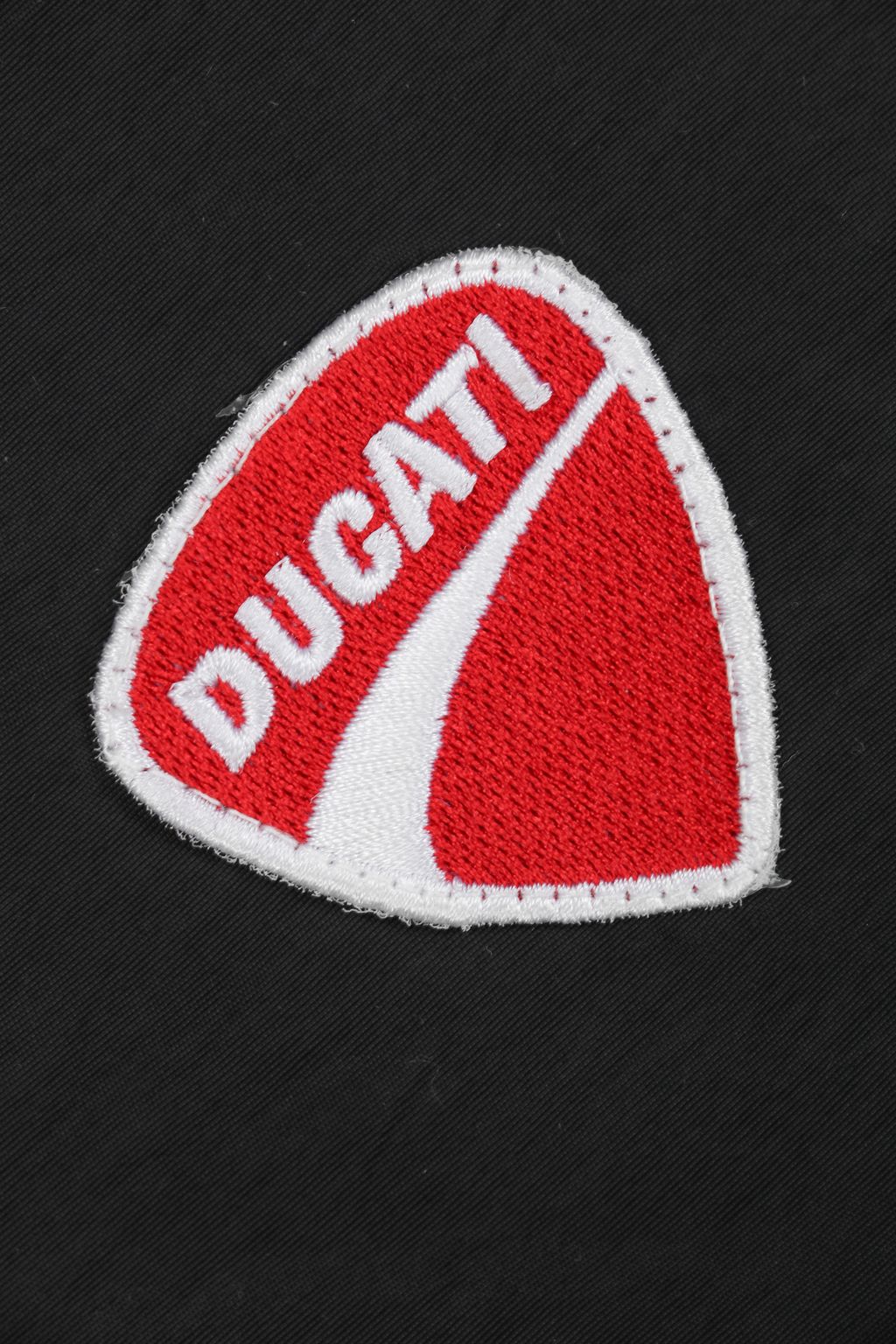 Supreme Ducati racing stand collar track jacket black matte technical fabric breathable mesh lining 3D silicone logo metal plaque YKK zipper unisex sizes S-XL