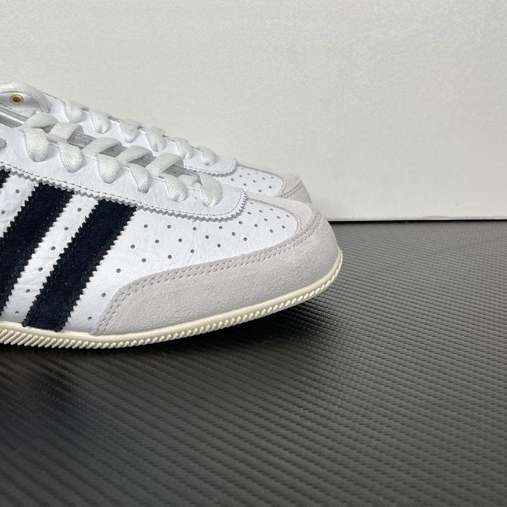 Shop adidas Japan IH5489 in Cloud White, Core Black and Gold Metallic with a leather upper, double-stitched T-toe and archival 1964 low-profile styling.