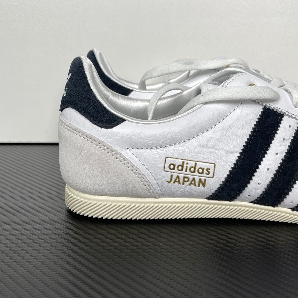 Shop adidas Japan IH5489 in Cloud White, Core Black and Gold Metallic with a leather upper, double-stitched T-toe and archival 1964 low-profile styling.