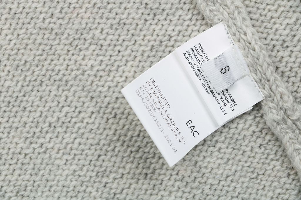 MM6 Maison Margiela signature letter hooded knit sweater light heather grey 80 percent wool 20 percent polyester handwritten print relaxed drop shoulder sizes S-XL