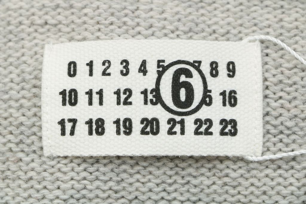 MM6 Maison Margiela signature letter hooded knit sweater light heather grey 80 percent wool 20 percent polyester handwritten print relaxed drop shoulder sizes S-XL