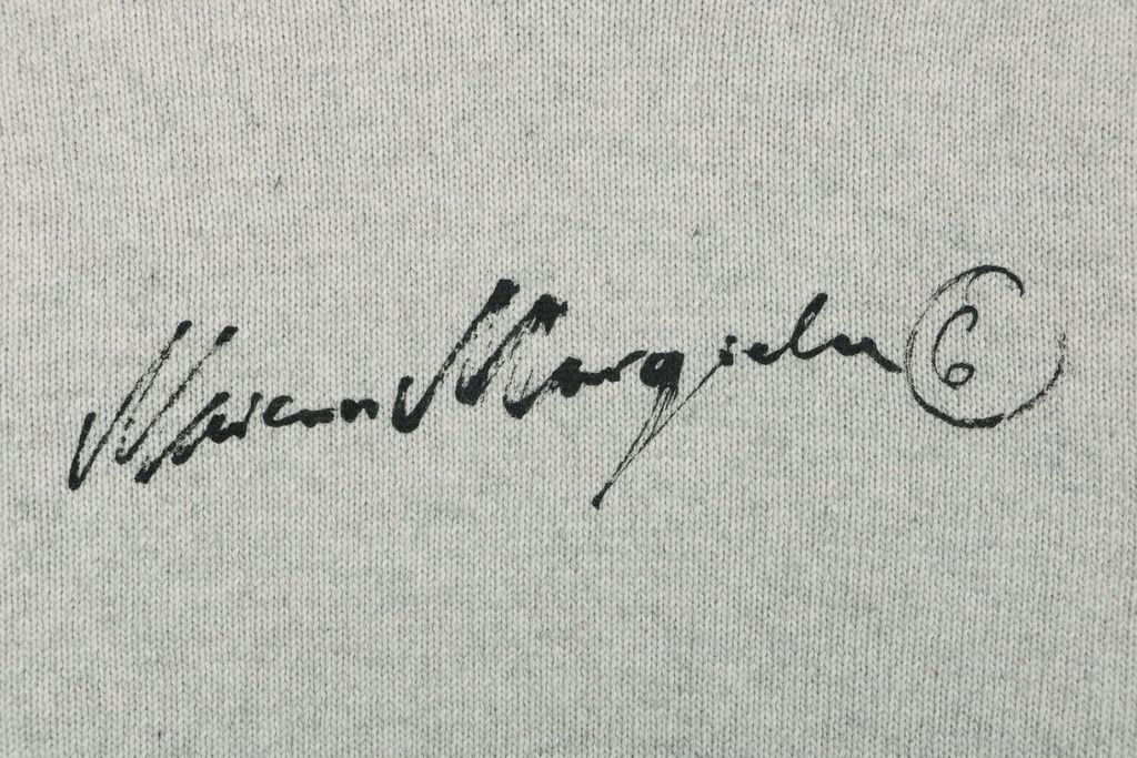 MM6 Maison Margiela signature letter hooded knit sweater light heather grey 80 percent wool 20 percent polyester handwritten print relaxed drop shoulder sizes S-XL