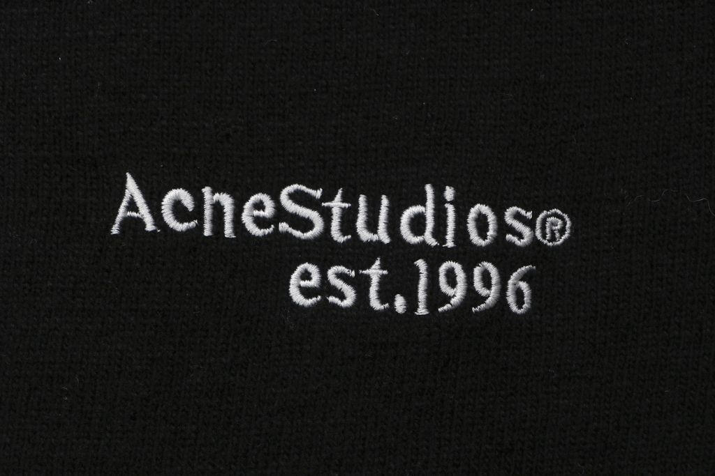 Acne Studios N8-1996 small logo embroidered polo sweater black yak wool blend 14 gauge STOLL knit raglan sleeves Tajima embroidery horn buttons sizes S-XL
