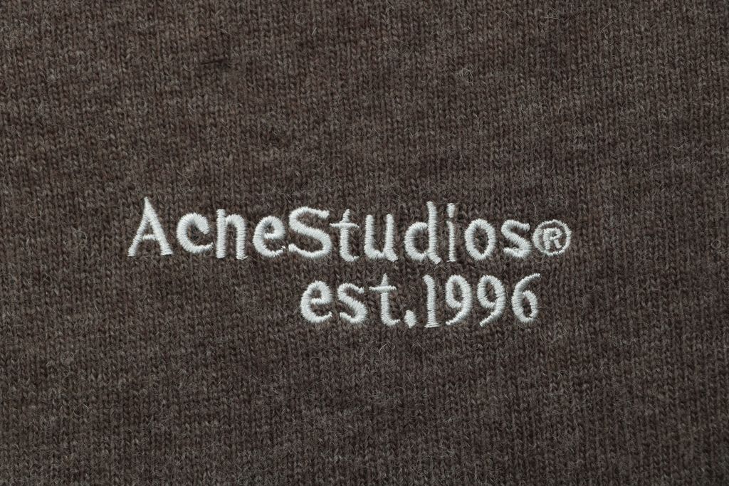 Acne Studios N8-1996 small logo embroidered polo sweater brown yak wool blend 14 gauge STOLL knit raglan sleeves Tajima embroidery horn buttons sizes S-XL