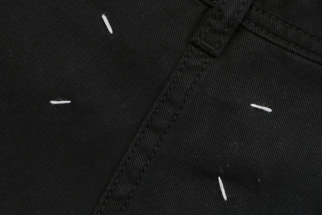 Maison Margiela four stitch trousers hand sewn back detail fully bound interior seams precision side topstitching custom finishing sizes S-XL