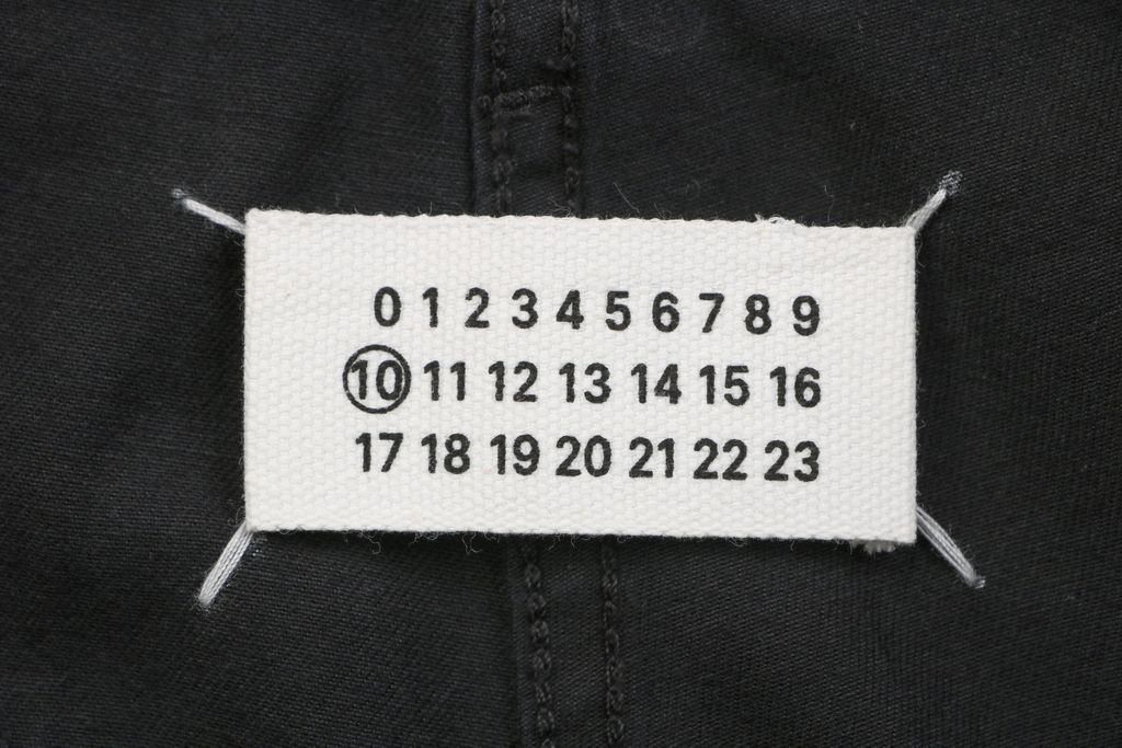Maison Margiela four stitch trousers hand sewn back detail fully bound interior seams precision side topstitching custom finishing sizes S-XL