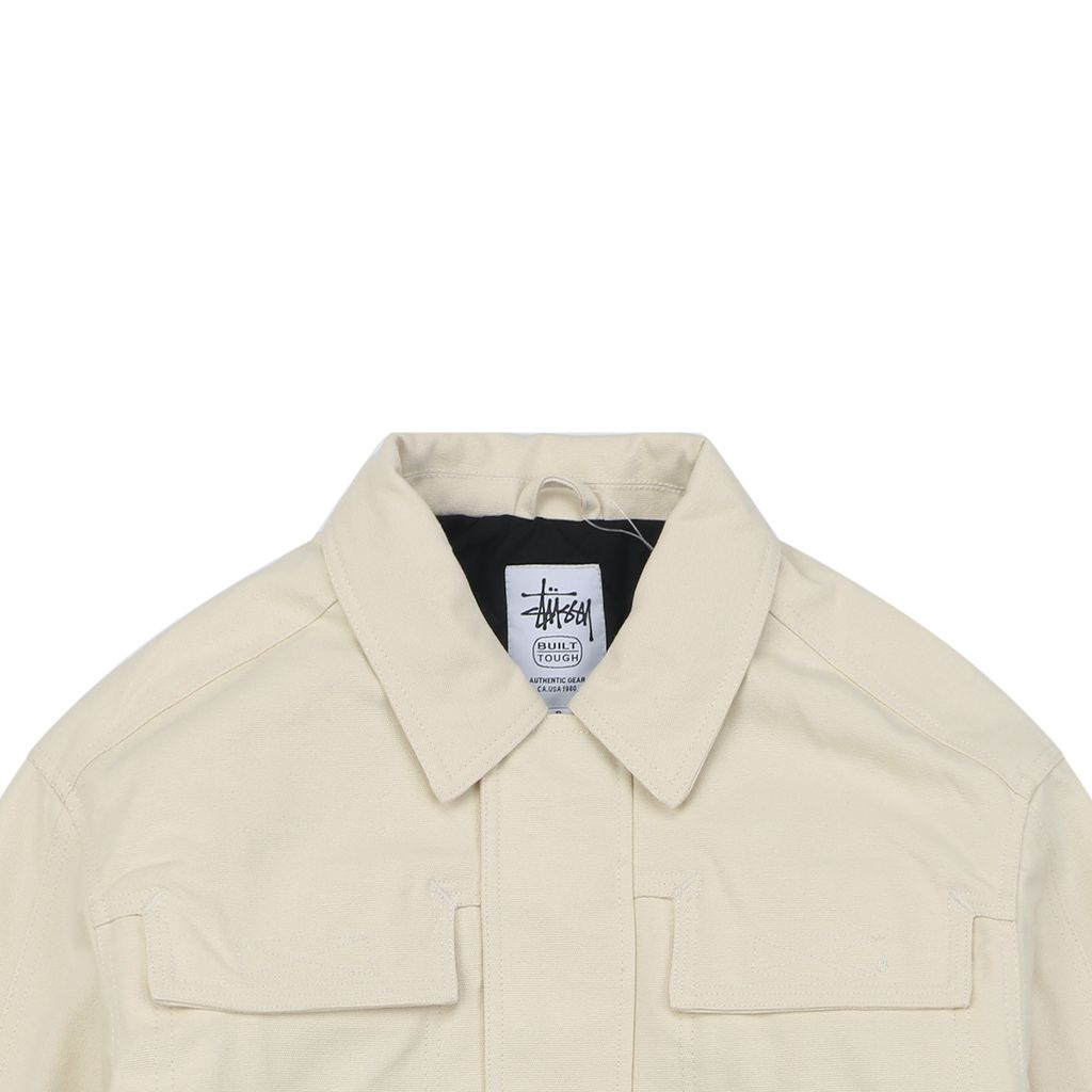 Stussy four pocket tonal jacquard embroidered work jacket beige structured fabric chest letter logo relaxed drop shoulder unisex utility outerwear sizes S-XL