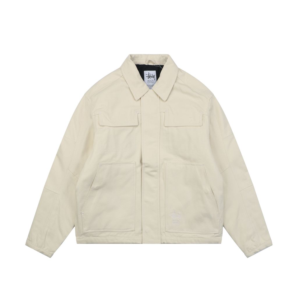 Stussy four pocket tonal jacquard embroidered work jacket beige structured fabric chest letter logo relaxed drop shoulder unisex utility outerwear sizes S-XL