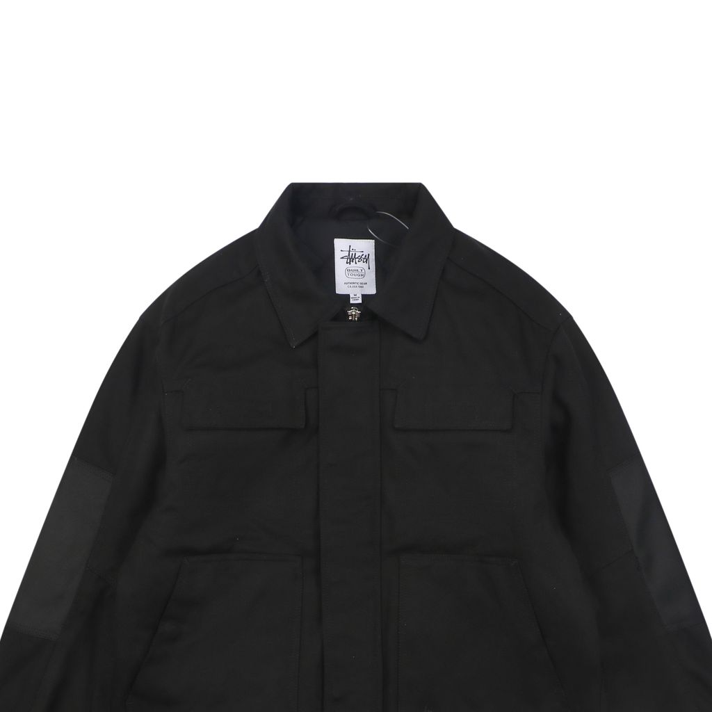 Stussy four pocket tonal jacquard embroidered work jacket black structured fabric chest letter logo relaxed drop shoulder unisex utility outerwear sizes S-XL