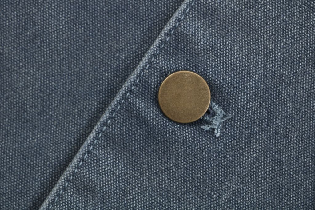 Prada washed triangle badge distressed utility jacket 100 percent polyester workwear fabric enzyme washed vintage faded finish sizes XS-L
