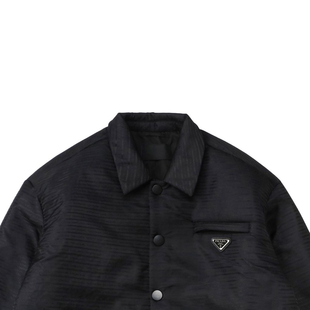 Prada triangle badge jacquard padded jacket recycled nylon logo fabric high density rayon lining 80g insulation custom hardware oversized fit sizes S-XL
