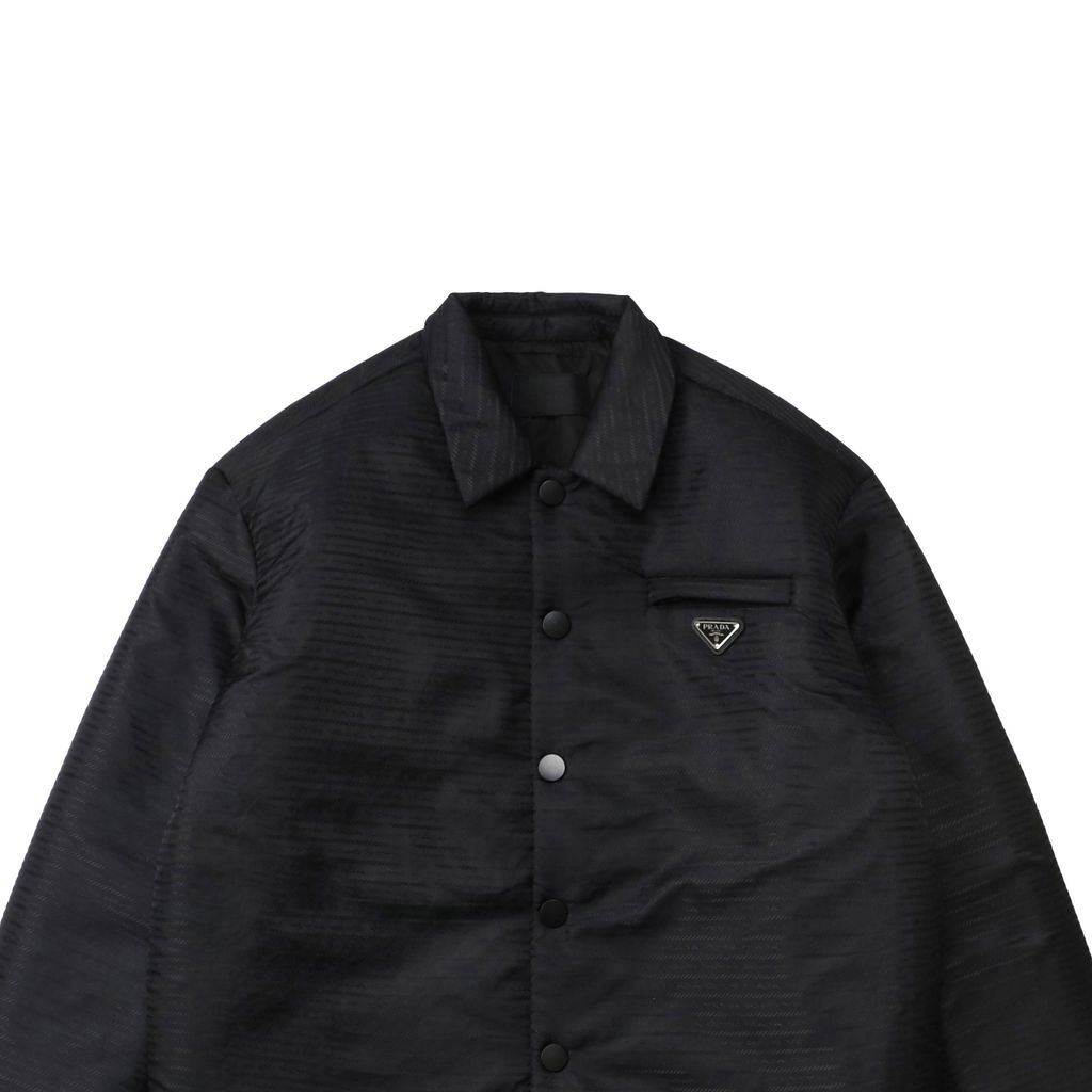 Prada triangle badge jacquard padded jacket recycled nylon logo fabric high density rayon lining 80g insulation custom hardware oversized fit sizes S-XL